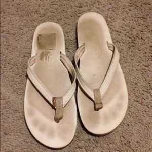 White leather rainbow flip flops